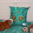 Guinea pig eating hay from Kavee Christmas hay bag