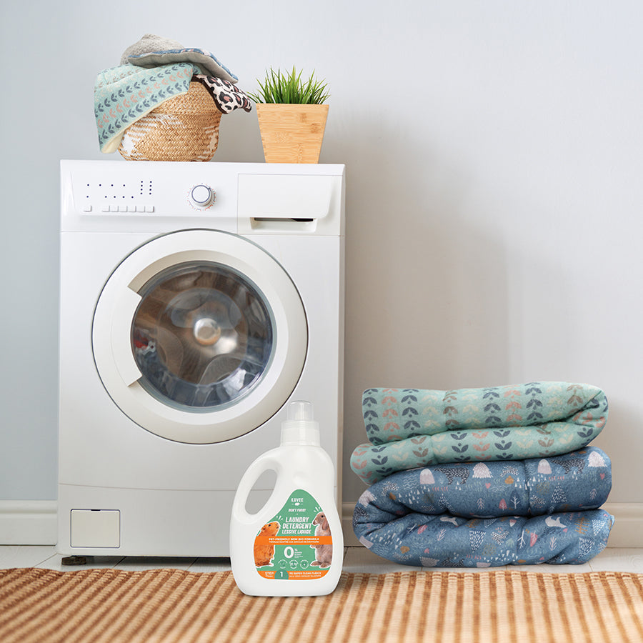 kavee laundry detergent on floor in front of washing machine