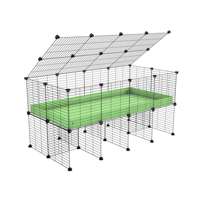 a 4x2 C&C cage for guinea pigs with a stand and a top green pastel pistachio plastic safe grids by kavee