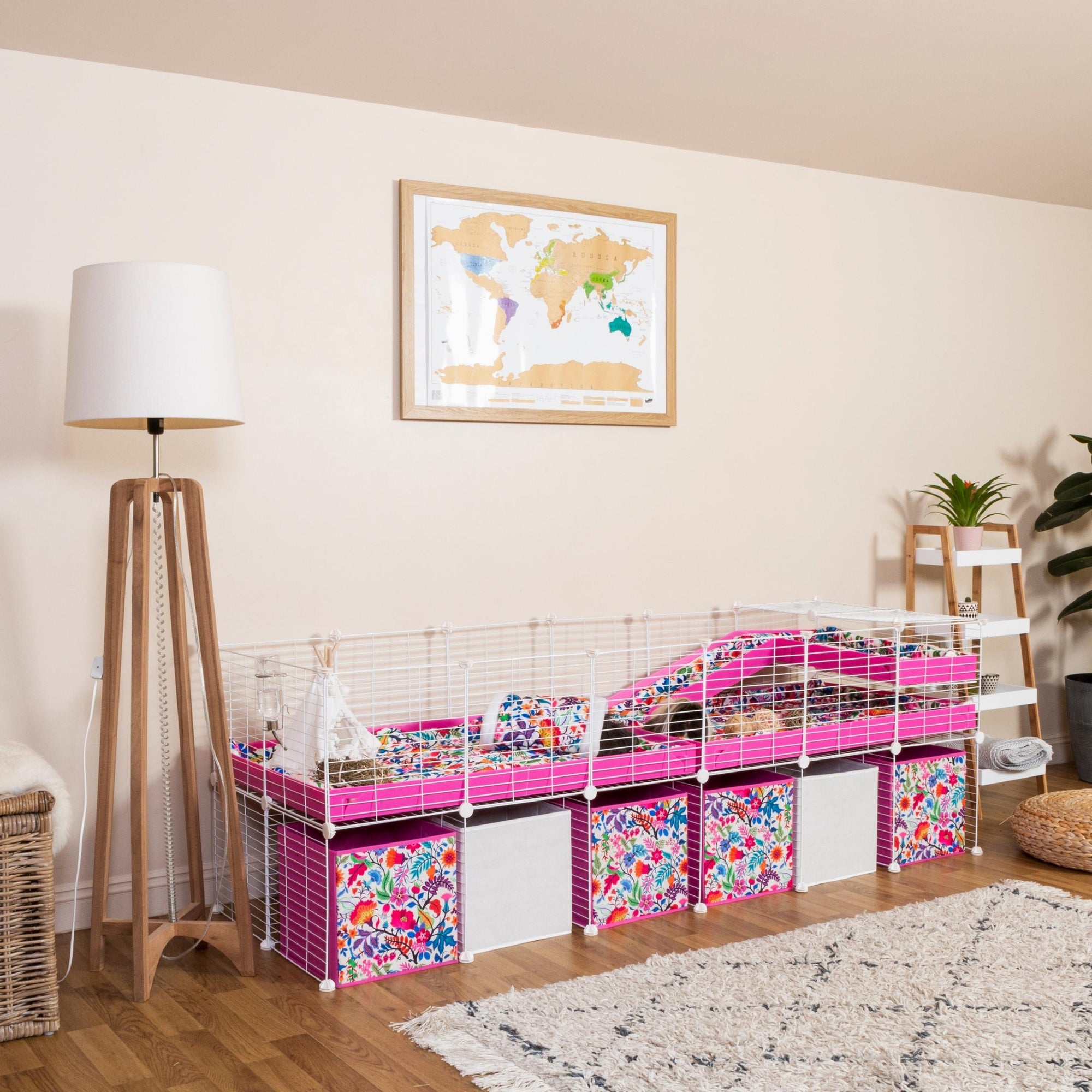 white 6x2 C&C cage for guinea pigs with stand, ramp and loft, and flower boxes pink coroplast from kavee