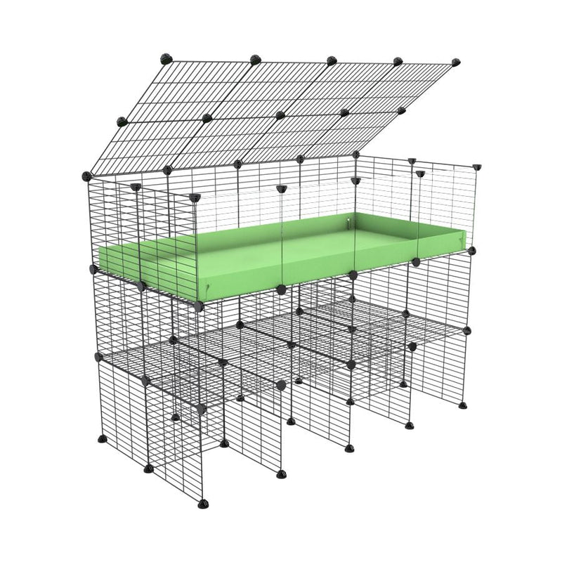 A 2x4 kavee C&C guinea pig cage with clear transparent plexiglass acrylic panels  with double stand a top green coroplast made of baby bars safe grids