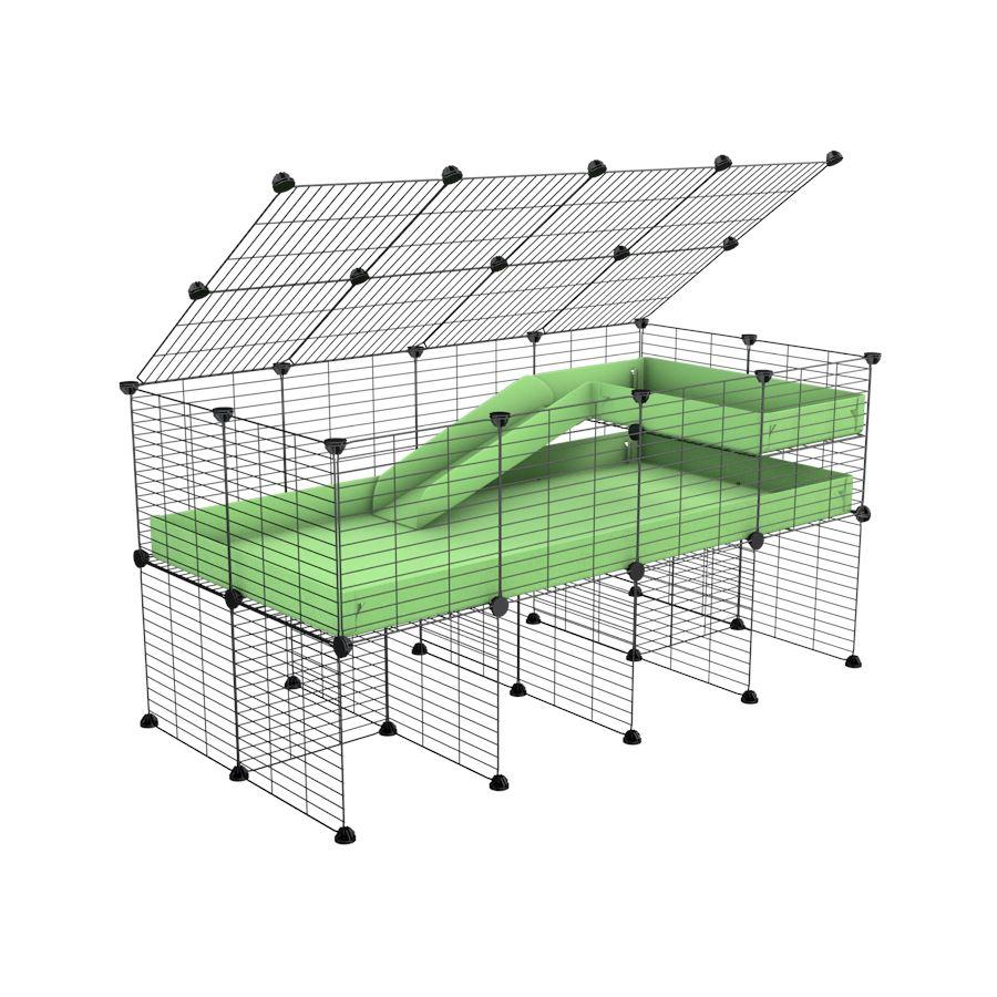 A 2x4 C and C guinea pig cage with stand loft ramp lid small size meshing safe grids green pastel pistachio correx sold in UK