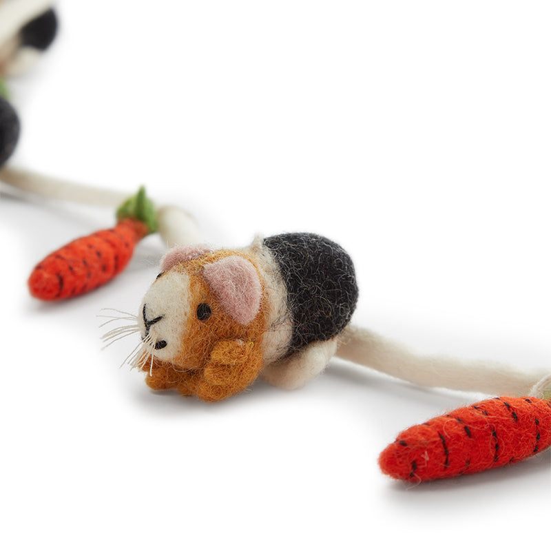 Close shot of Felt Garland Decoration Guinea Pig with Carrots