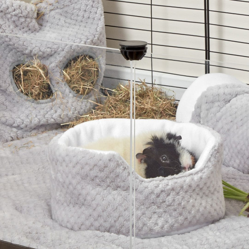 guinea pig lay inside of a kavee grey cuddle cup on top of a kavee fleece liner